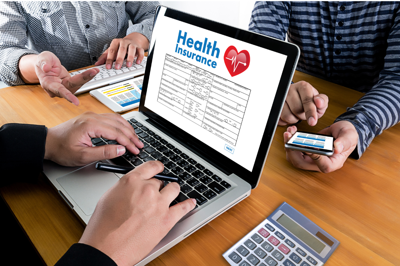 Applying for Care Health Insurance policy online on a laptop