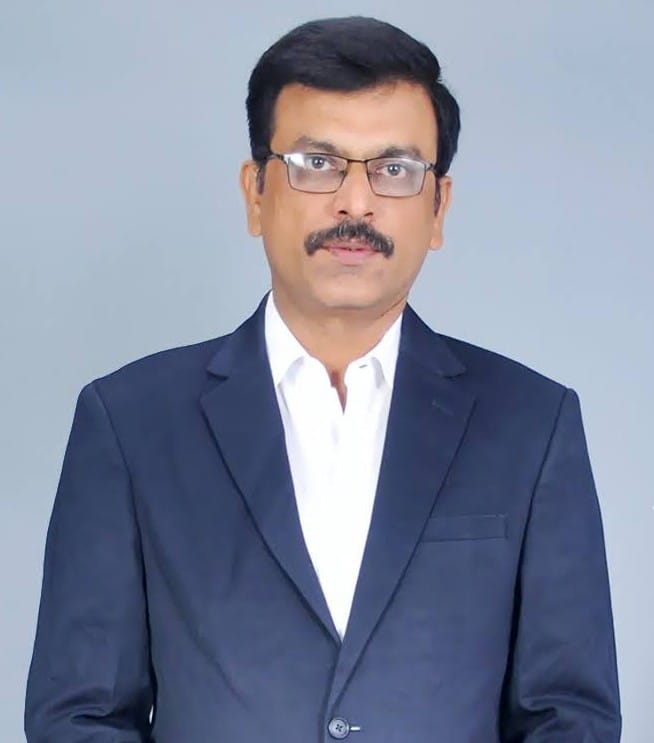 Professional male investment planner in a dark suit and glasses